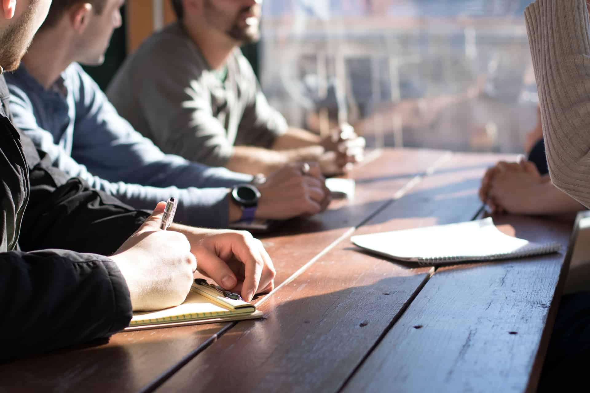 People sat together around a table